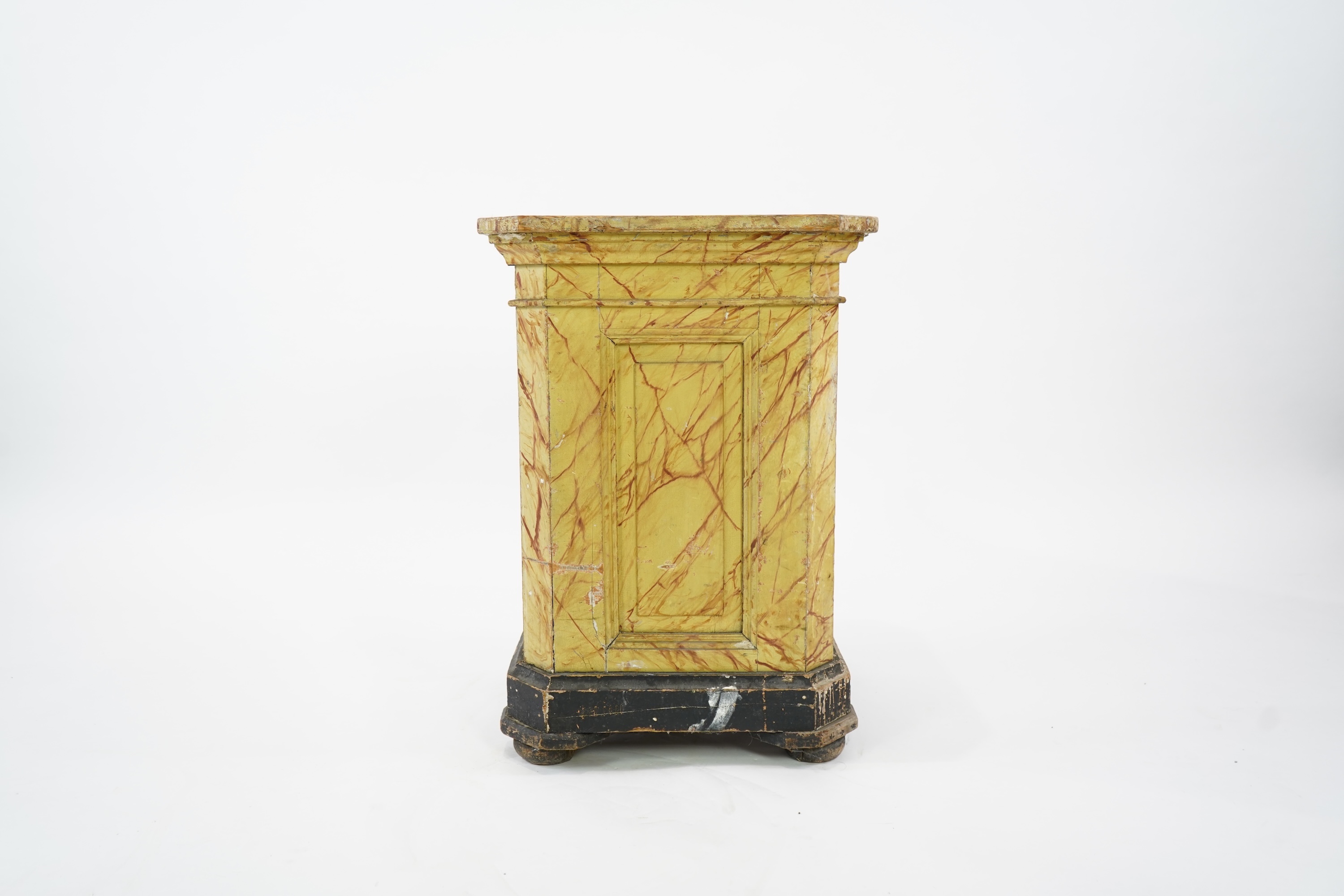 A Victorian white painted cast iron urn and a painted faux marble pedestal